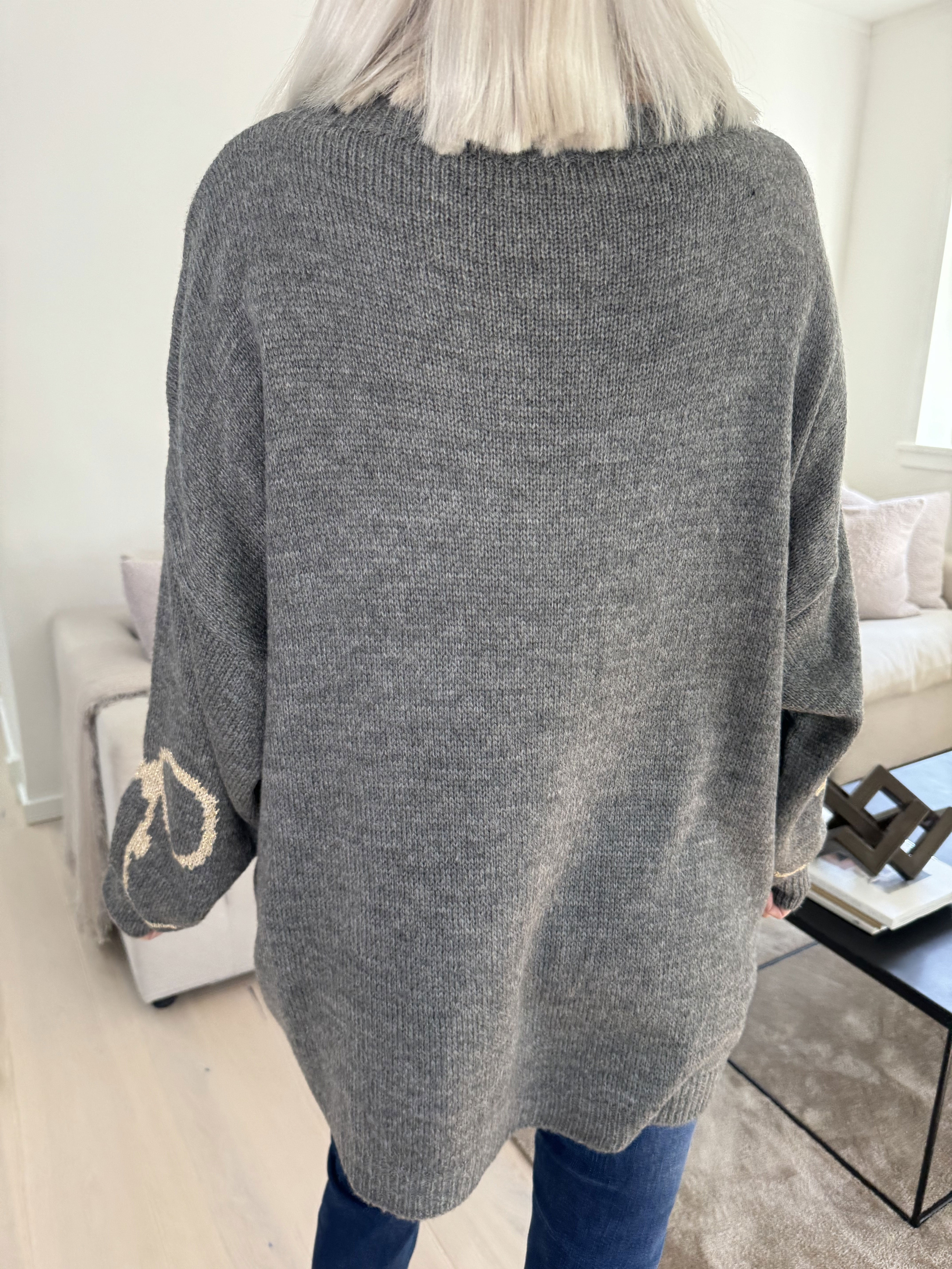 Ruby - Striktrøje med uld og sløjfe i guldtråde